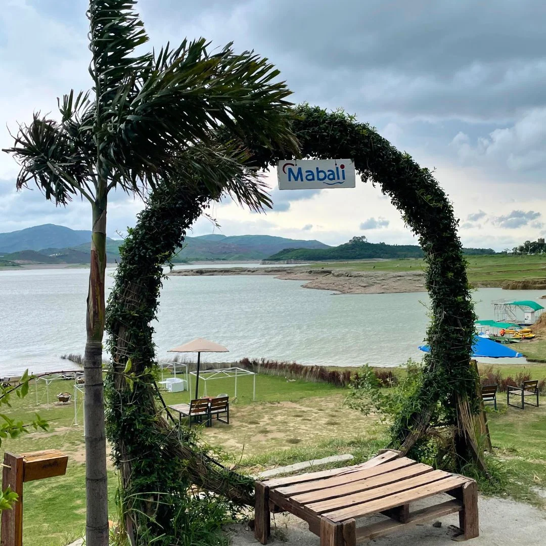 Mabali Island resort at Khanpur Lake with scenic hills and clear blue water